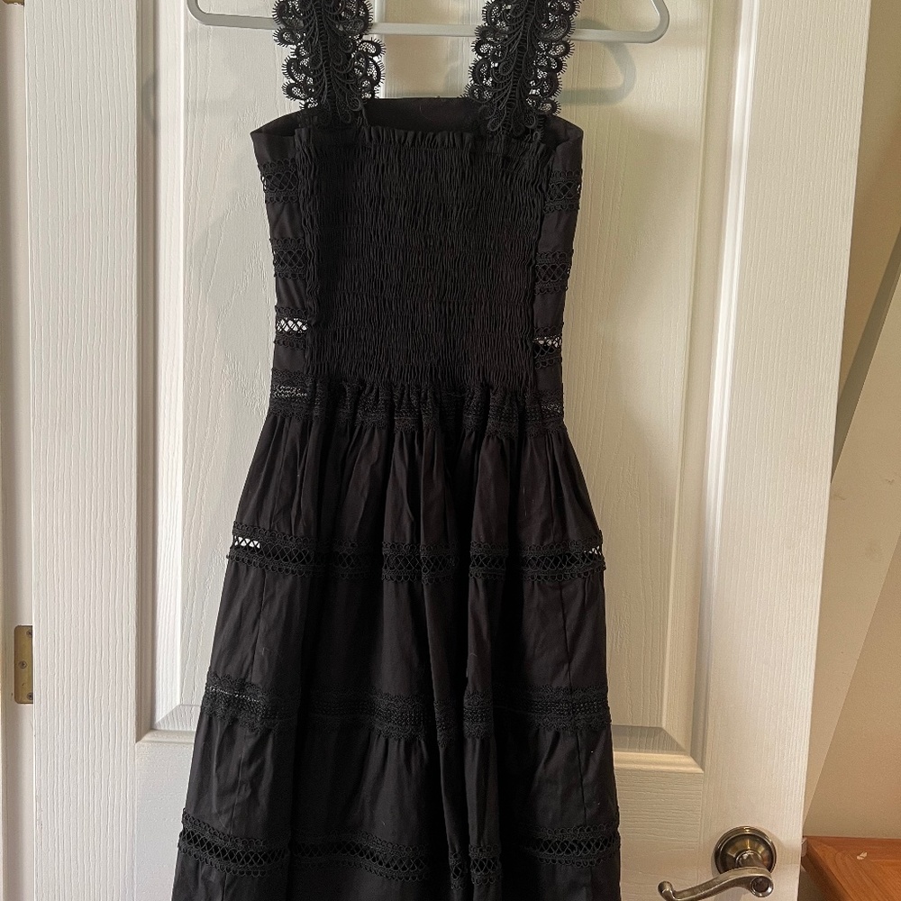 Black strappy dress by Waimari